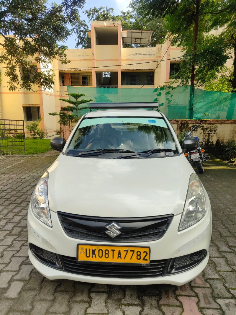 A Swift Dzire cleaned and checked before pickup